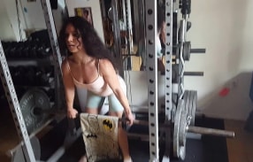 Tia working her biceps and arms at the gym